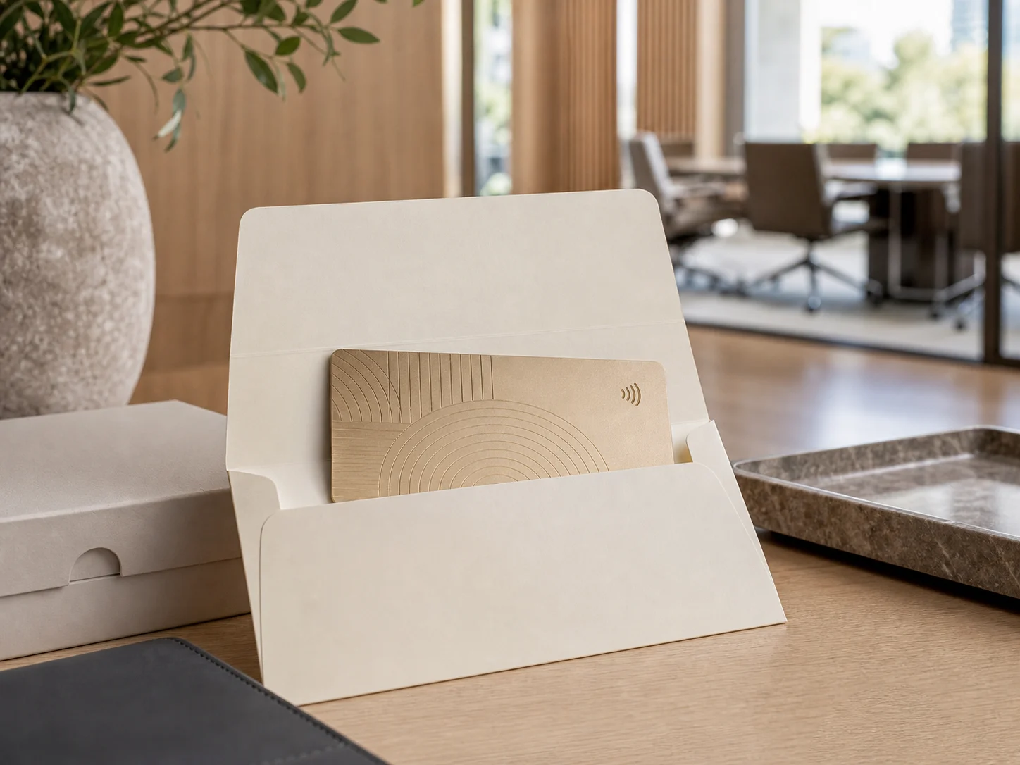 Champagne-gold metal visitor RFID badge in a guest envelope