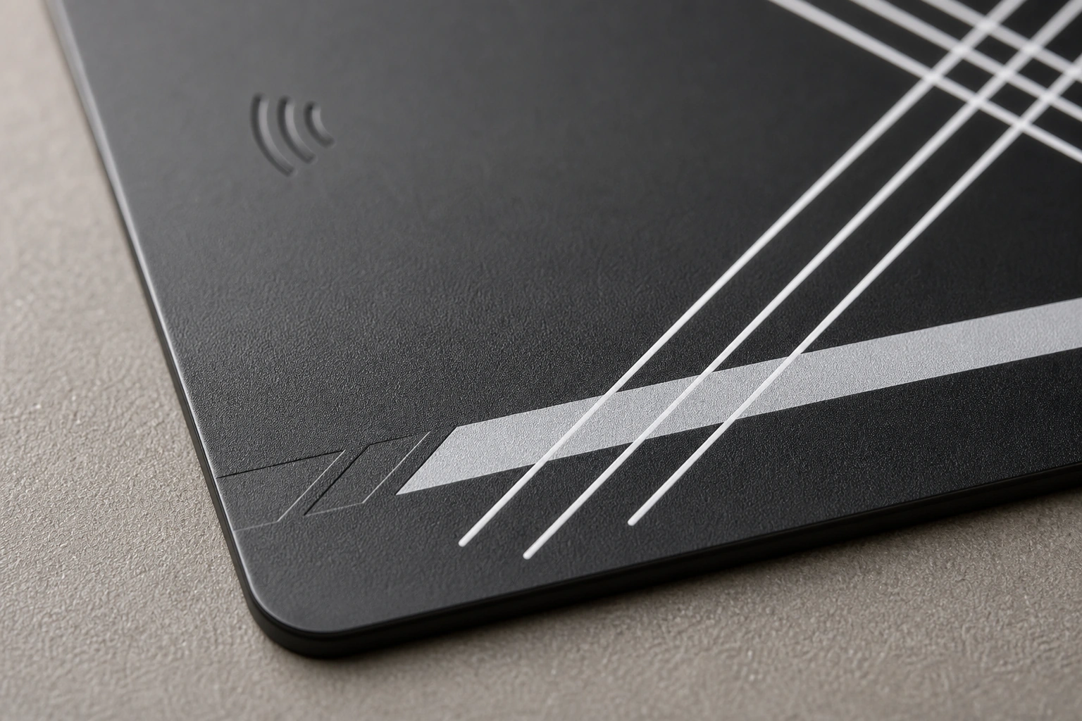Matte black metal surface macro with full-card inset