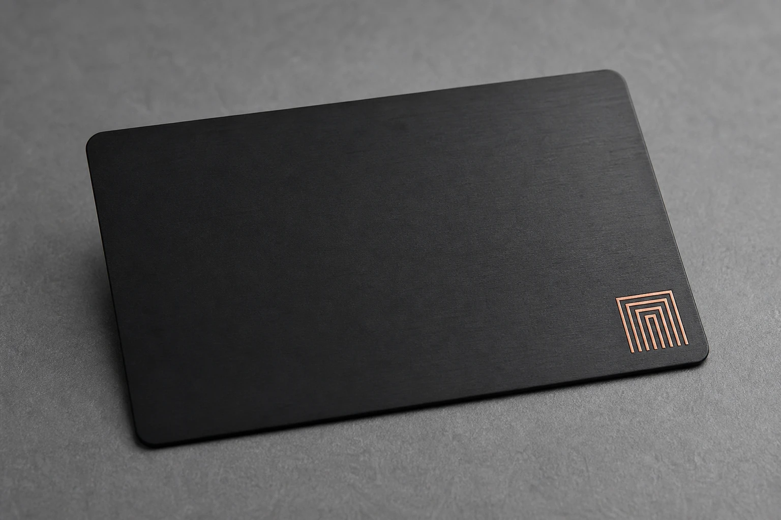 Black card with a copper enamel accent