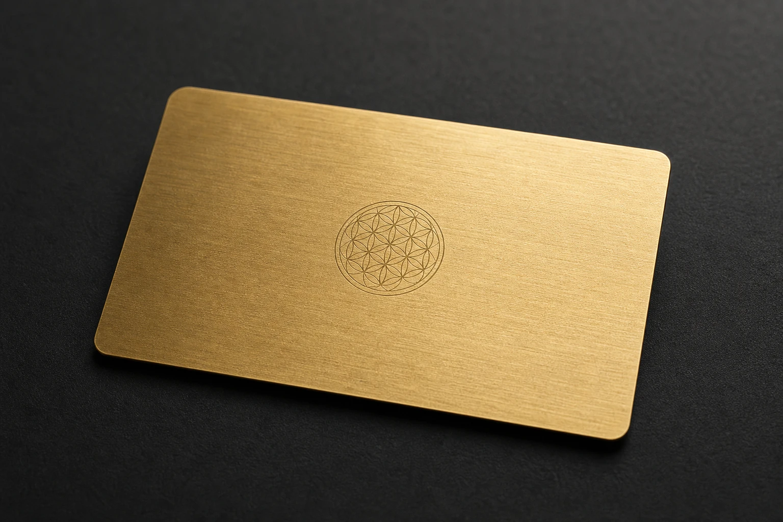 Warm brass card with fine laser geometry
