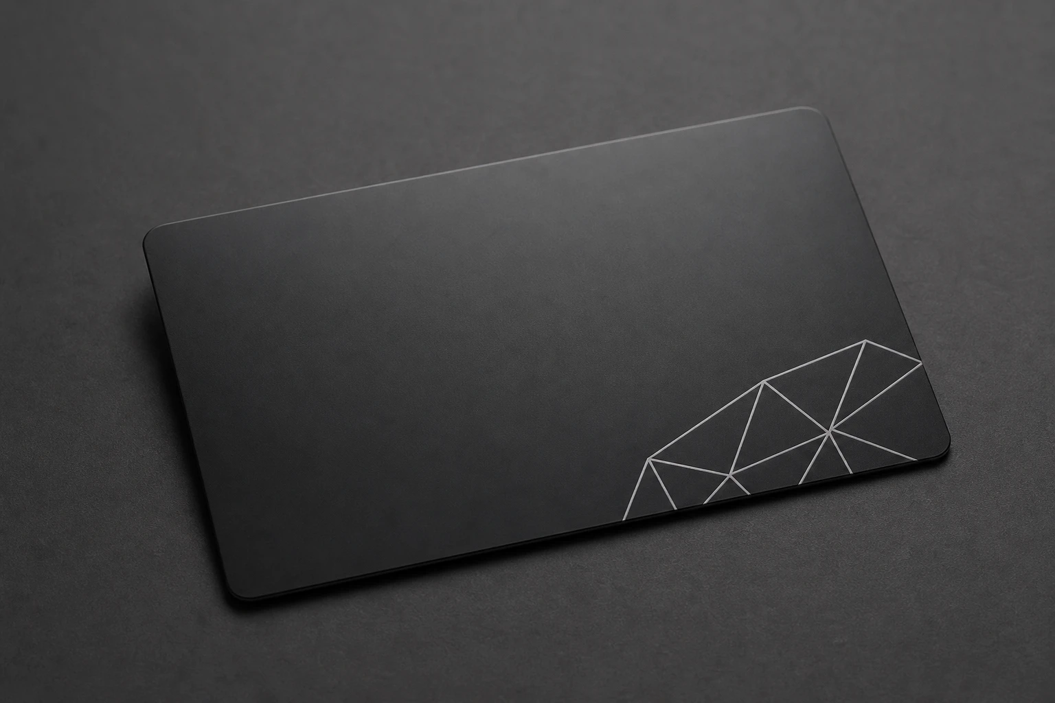 Black card with crisp white geometric ink