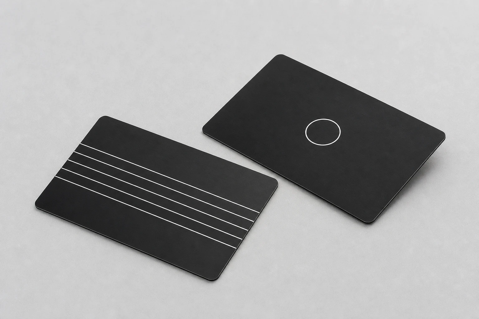 Two black cards showing white-ink variations