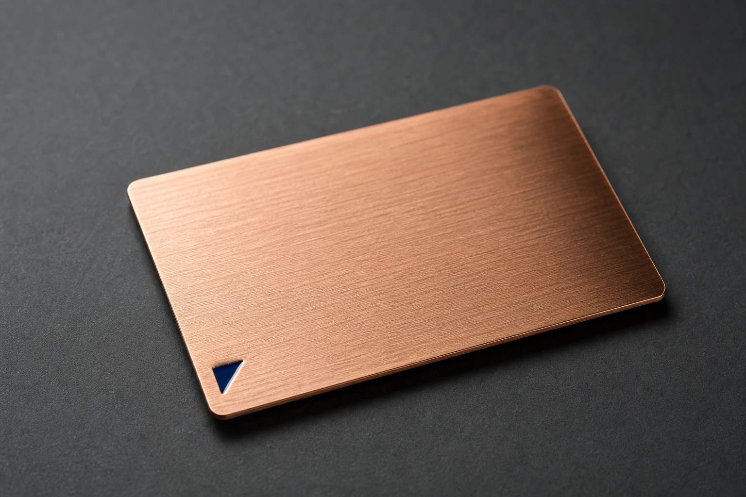 Copper metal card with a recessed navy enamel detail