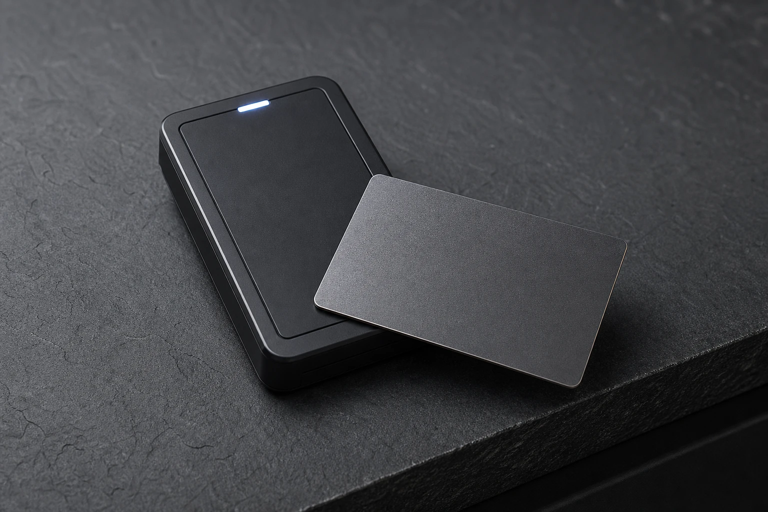 Gunmetal metal RFID card at a secure reader