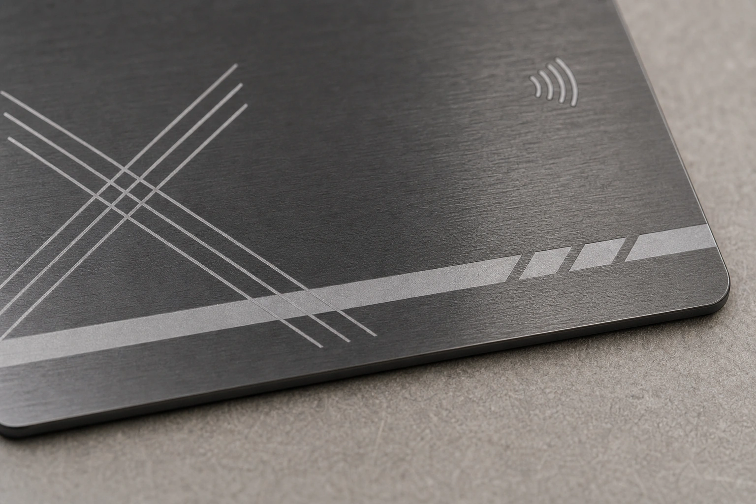 Titanium / gunmetal surface macro with full-card inset